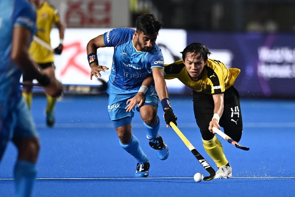 India belasah skuad hoki negara